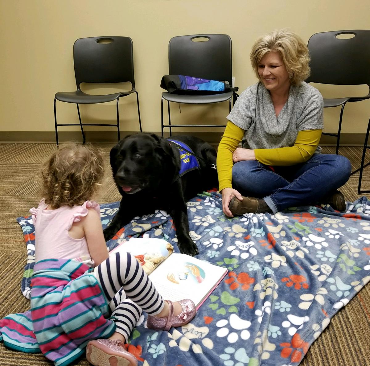 Reading with Beau at Library Helps Children Learn